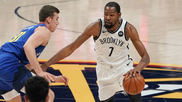 Brooklyn Nets forward Kevin Durant (7) drives against the Denver Nuggets